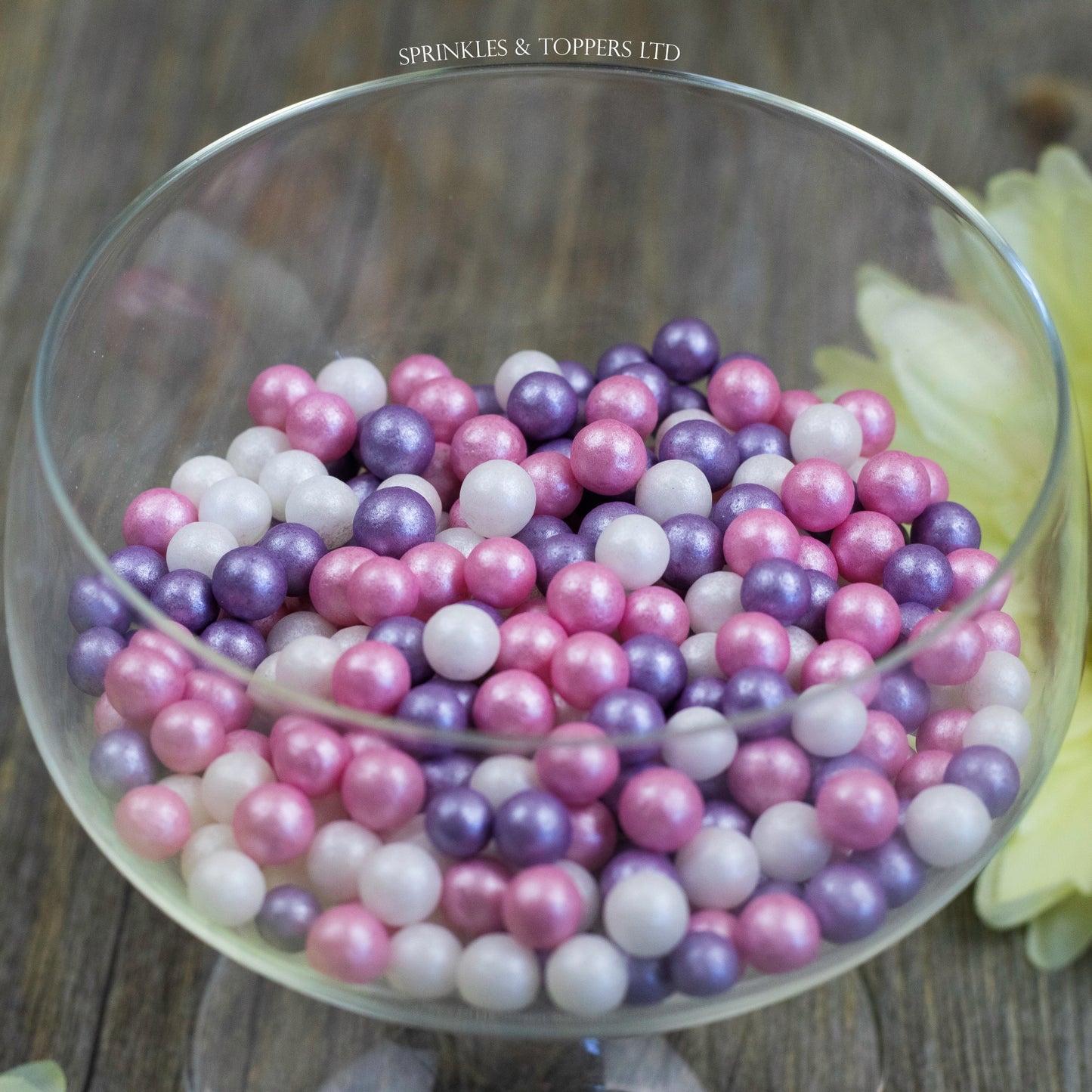 Lovely pink, purple and white edible sugar pearls with shiny finish 7mm (approx) Perfect to decorate cupcakes, a large cake, ice creams, smoothies, cookies.....the list is endless Packaged in sealed food safe bag