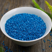 Load image into Gallery viewer, Edible blue sugar crystals with a lovely shiny finish  Suitable for Vegetarians  Perfect to top any cupcake, large cake, ice cream, cookies, shakes and more...
