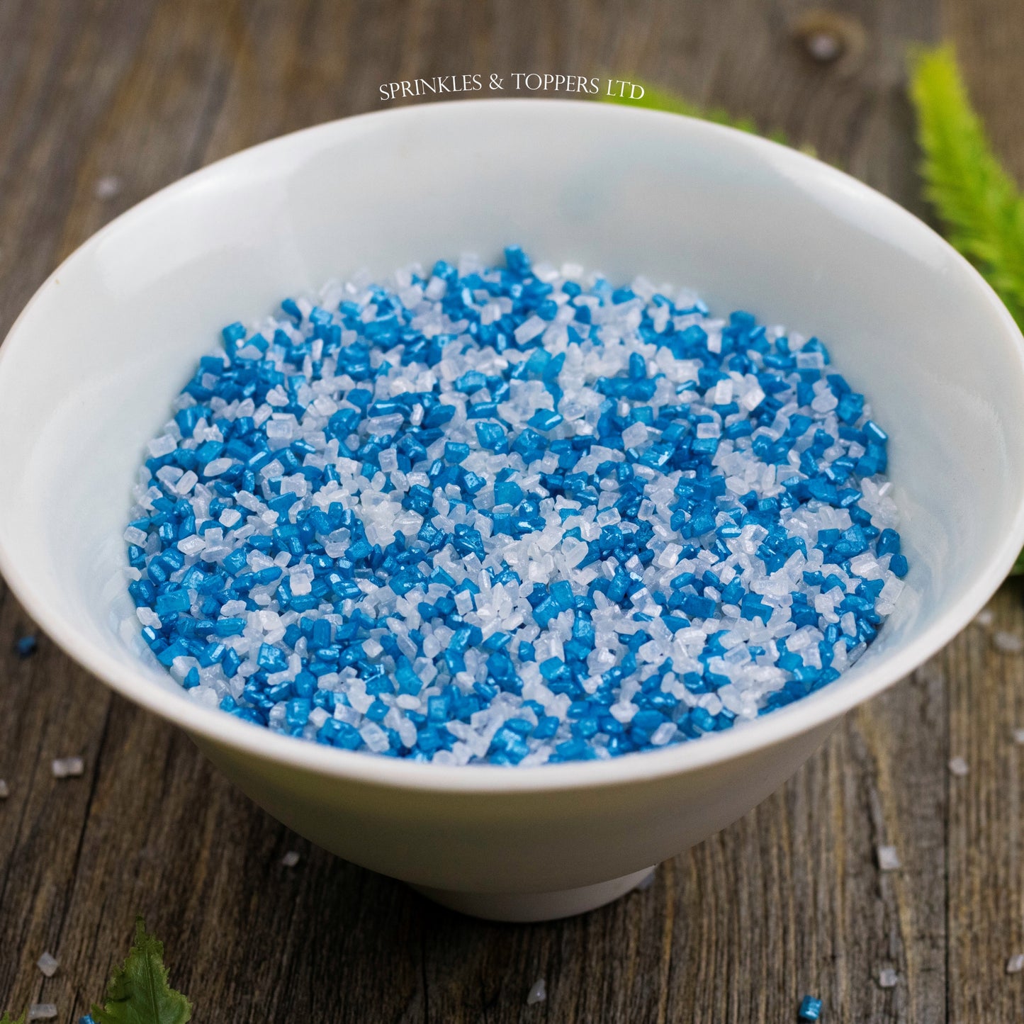 Edible blue and white sugar crystals with a lovely shiny finish  Perfect to top any cupcake, large cake, ice cream, cookies, shakes and more...