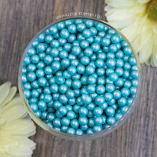 Load image into Gallery viewer, Lovely turquoise edible sugar pearls with shiny finish 7mm (approx)  Perfect to decorate cupcakes, a large cake, ice creams, smoothies, cookies.....the list is endless