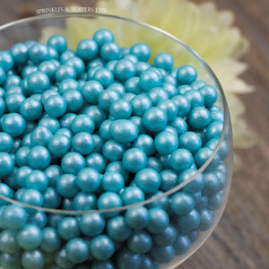 Lovely turquoise edible sugar pearls with shiny finish 7mm (approx)  Perfect to decorate cupcakes, a large cake, ice creams, smoothies, cookies.....the list is endless