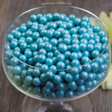 Load image into Gallery viewer, Lovely turquoise edible sugar pearls with shiny finish 7mm (approx)  Perfect to decorate cupcakes, a large cake, ice creams, smoothies, cookies.....the list is endless
