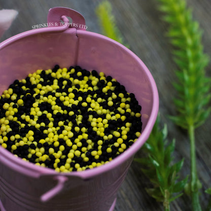 Black & Yellow 100s & 1000s  These ever popular small sugar balls are perfect to top any cupcake, large cake, ice cream, shake and more...