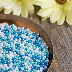 Blue, White & Turquoise Glimmer Pearls Sprinkles Mix  Lovely edible sugar pearls with shiny finish 3-4mm (approx)  Perfect to decorate cupcakes, a large cake, ice creams, smoothies, cookies.....the list is endless