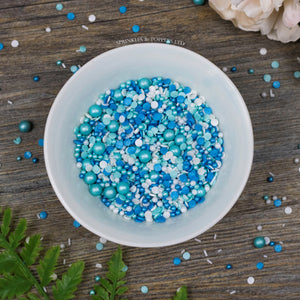 Perfect to top any cupcake or to decorate a larger cake, ice creams, smoothies, cookies and more  Lovely mix of blue, turquoise & white glimmer pearls & confetti (4mm), turquoise glimmer pearls (7mm), white sugar strands