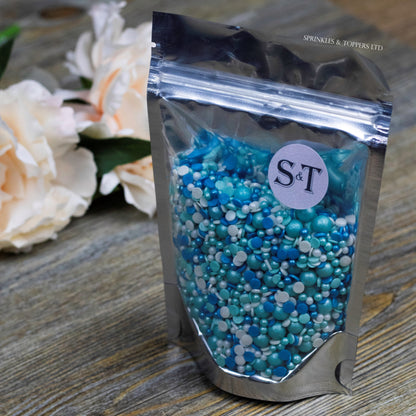 Perfect to top any cupcake or to decorate a larger cake, ice creams, smoothies, cookies and more  Lovely mix of blue, turquoise & white glimmer pearls & confetti (4mm), turquoise glimmer pearls (7mm), white sugar strands